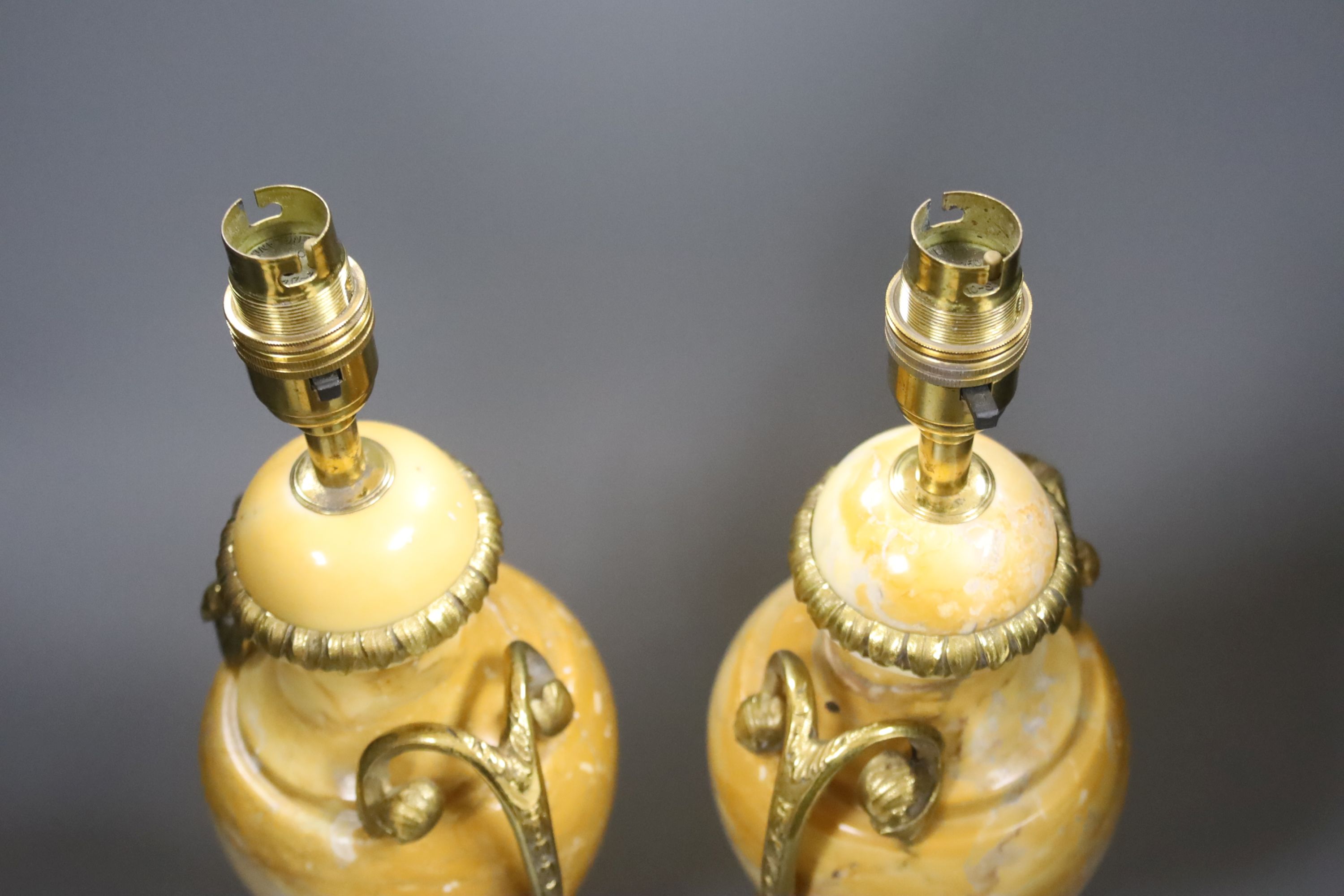 A pair of 20th century French marble and ormolu urn shape table lamps, overall height 43cm